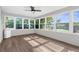 Bright sun room featuring multiple windows and hardwood floors at 913 64Th W St, Bradenton, FL 34209