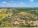 Expansive aerial view of a property featuring mature trees and a home within a designated boundary at 10001 289Th E St, Myakka City, FL 34251