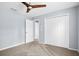 Bedroom featuring double closet, carpet, and neutral walls at 10001 289Th E St, Myakka City, FL 34251
