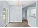 Bright kitchen area with modern finishes, laminate flooring, sliding glass doors to the outside and open counter area at 10001 289Th E St, Myakka City, FL 34251