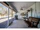 Inviting screened patio with a swing, a view, and room for grilling at 10001 289Th E St, Myakka City, FL 34251