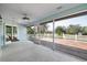 Inviting screened porch with a swing and expansive views of the property's outdoor space at 10001 289Th E St, Myakka City, FL 34251