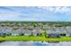 Houses arranged along a pond in a community at 1017 Fernleaf Run, Bradenton, FL 34212