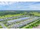 Gorgeous aerial view of a peaceful community surrounding a scenic lake, featuring well-spaced homes at 1017 Fernleaf Run, Bradenton, FL 34212