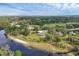 Expansive aerial view of the property, surrounded by lush landscapes and pristine river frontage at 1017 Fernleaf Run, Bradenton, FL 34212