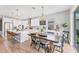 Bright and airy dining area featuring stylish chandelier and bar stool seating at 1017 Fernleaf Run, Bradenton, FL 34212