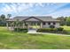 Charming community pavilion with picnic tables and lush landscaping, perfect for outdoor gatherings at 1017 Fernleaf Run, Bradenton, FL 34212