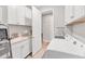 The laundry room features cabinetry, front loading washer and dryer, and a utility sink at 1017 Fernleaf Run, Bradenton, FL 34212