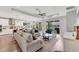 Spacious living room with a ceiling fan and hardwood floors, offering a relaxed atmosphere at 1017 Fernleaf Run, Bradenton, FL 34212