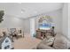 Cozy loft area with TV, chairs, and sofa, perfect for entertainment or relaxation at 1017 Fernleaf Run, Bradenton, FL 34212