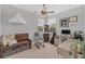 This home office features neutral walls, large windows and ceiling fan with light at 1017 Fernleaf Run, Bradenton, FL 34212