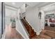 Elegant staircase with wood treads and iron railings, leading to the upper level at 1017 Fernleaf Run, Bradenton, FL 34212