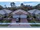 Aerial view of side-by-side homes with brick driveways and well-maintained landscaping at 12091 Firewheel Pl, Venice, FL 34293
