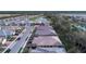 New homes line a street with a water view, offering a serene neighborhood setting at 12091 Firewheel Pl, Venice, FL 34293
