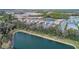 Aerial perspective of homes and lakes, surrounded by mature trees and landscaping at 12091 Firewheel Pl, Venice, FL 34293