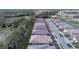Aerial view of new homes with manicured lawns and tree-lined streets at 12091 Firewheel Pl, Venice, FL 34293