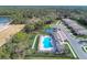 Community amenities include a pool, bocce ball, and tennis courts in a lush setting at 12091 Firewheel Pl, Venice, FL 34293