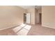 Well-lit bedroom featuring carpeted floors and a pair of doors at 12091 Firewheel Pl, Venice, FL 34293