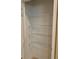 Bright closet featuring four sturdy wire shelves for organized storage solutions at 12091 Firewheel Pl, Venice, FL 34293