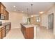 Open-concept kitchen with an island and stainless steel appliances at 12091 Firewheel Pl, Venice, FL 34293