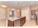 Spacious kitchen island featuring granite countertops and stainless steel appliances at 12091 Firewheel Pl, Venice, FL 34293