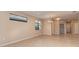 Bright living room with tiled flooring, a modern chandelier, and access to other rooms at 12091 Firewheel Pl, Venice, FL 34293