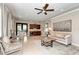 Elegant clubhouse living room featuring stylish furnishings, art, and a convenient kitchenette at 12091 Firewheel Pl, Venice, FL 34293