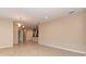 Spacious open living area with tiled flooring, neutral paint, and recessed lighting at 12091 Firewheel Pl, Venice, FL 34293