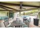 Inviting outdoor patio area with ceiling fans, comfortable seating, and a pool view at 12091 Firewheel Pl, Venice, FL 34293