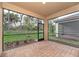 Screened patio with brick floor, offering serene outdoor living space and natural light at 12091 Firewheel Pl, Venice, FL 34293