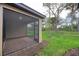 Screened porch with brick, offering a peaceful outdoor retreat and views of backyard at 12091 Firewheel Pl, Venice, FL 34293