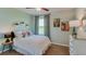 Bright bedroom featuring a comfortable bed, stylish curtains, and tasteful wall decor at 12115 Kingsley Trl, Parrish, FL 34219