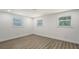 Inviting bedroom with light-colored floors, a ceiling light, and bright windows at 1227 Porpoise Rd, Venice, FL 34293