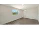 Bright bedroom with wood-look floors and a view of the backyard at 1227 Porpoise Rd, Venice, FL 34293