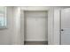Spacious closet features an open layout, wire shelving, and gray wood flooring at 1227 Porpoise Rd, Venice, FL 34293