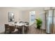 Cozy dining area with modern table and chairs near kitchen and view to outside at 1227 Porpoise Rd, Venice, FL 34293