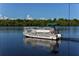 South Venice Beach Ferry boat on the water with lush green shoreline in the background at 1227 Porpoise Rd, Venice, FL 34293