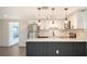 Newly remodeled kitchen boasts stainless steel appliances, quartz counters and eat-in bar at 1227 Porpoise Rd, Venice, FL 34293