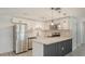 Updated kitchen features stainless steel appliances, quartz counters and new cabinets at 1227 Porpoise Rd, Venice, FL 34293