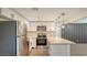 Gorgeous kitchen with stainless appliances, stylish pendants, and eat-in island at 1227 Porpoise Rd, Venice, FL 34293