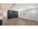 Spacious living room with vinyl flooring, lots of light and access to the kitchen at 1227 Porpoise Rd, Venice, FL 34293