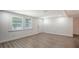 Bright and airy living room featuring vinyl plank flooring and natural light at 1227 Porpoise Rd, Venice, FL 34293