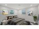 Bright and airy main bedroom with neutral decor, large windows, and comfortable bed at 1227 Porpoise Rd, Venice, FL 34293