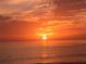 Breathtaking sunset view over tranquil ocean waters, creating a vibrant and warm ambiance at 1227 Porpoise Rd, Venice, FL 34293