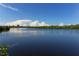 Scenic view of a serene waterway surrounded by lush mangroves and a clear blue sky at 1227 Porpoise Rd, Venice, FL 34293