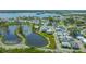 An aerial view highlighting the property's position within a pond-side residential community at 13 Oak St, Bradenton, FL 34208