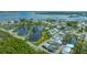 An aerial view capturing the property's setting near a pond and neighborhood layout at 13 Oak St, Bradenton, FL 34208