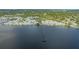 Aerial view showcasing the property's waterfront location, access to pier, and community amenities at 13 Oak St, Bradenton, FL 34208