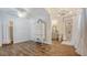 An expansive bedroom with an ensuite bathroom, chandelier, and wood-look floors at 13 Oak St, Bradenton, FL 34208