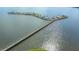 Aerial view of a long boat dock for residents in the Historic Braden Castle community at 13 Oak St, Bradenton, FL 34208